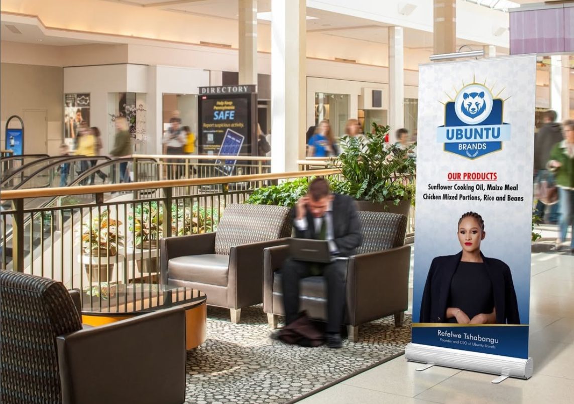 Pull-up product banner displayed in a shopping mall walkway