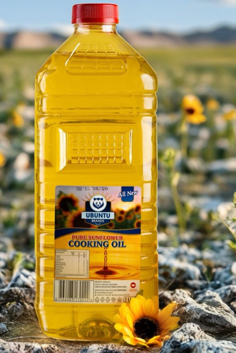 Bottle of sunflower cooking oil standing outdoors in a field